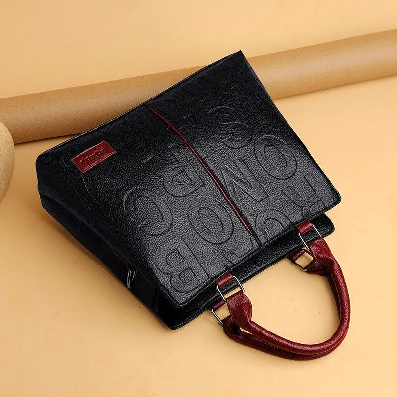 2023 New Fashion Solid Color Shoulder Large Capacity Soft Leather Cloth Letter Embossed Ladies Handbag